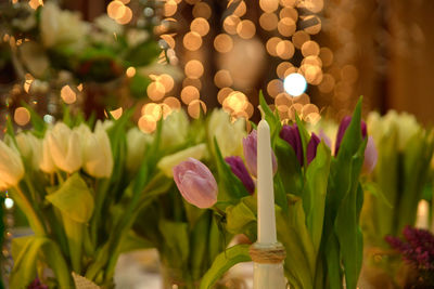 Restaurant table setting ,tulips and candle.
