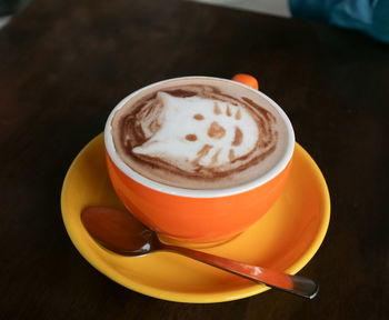 Close-up of cappuccino on table