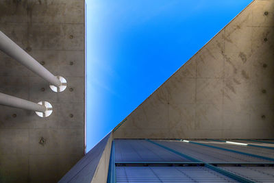 Low angle view of building against blue sky