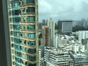 Buildings in city against sky