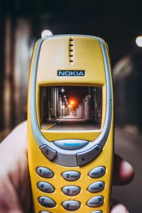 Close-up of hand holding camera