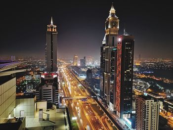 Illuminated buildings in city at night