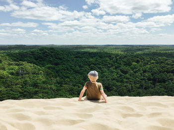 Rear view of boy at dune du pilat