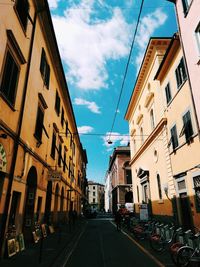 Street amidst buildings against sky