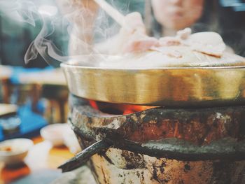 Close-up of person preparing food