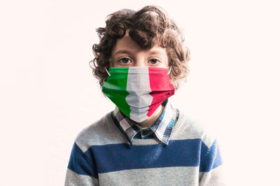 Portrait of teenage boy against white background