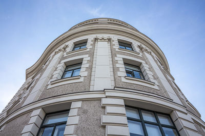 Low angle view of building against blue sky