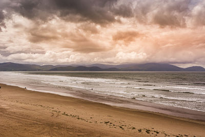 Scenic view of beach against sky during sunset