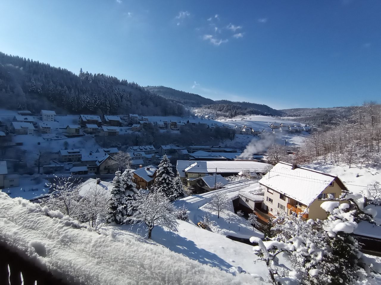 SNOW COVERED BUILDINGS AGAINST SKY