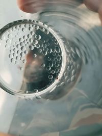 High angle view of person drinking water in glass