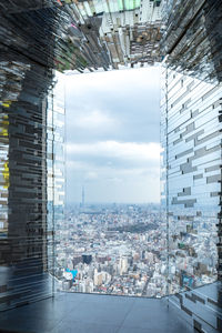 Buildings in city against sky