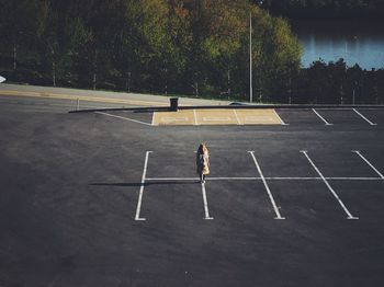 High angle view of woman standing on road