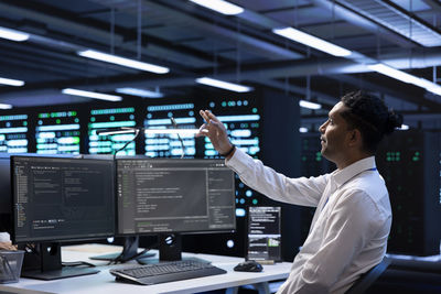 Side view of businessman working in office