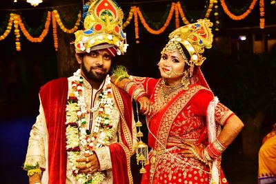 Young couple looking at traditional clothing