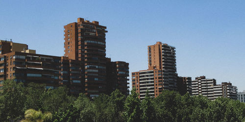 Modern buildings against clear sky