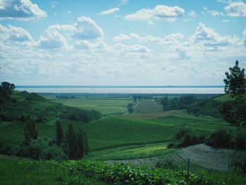 Scenic view of landscape against cloudy sky