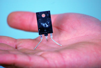 Close-up of computer chip on hand