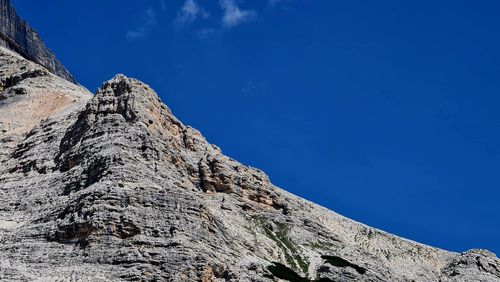 Low angle view of rock formations against sky