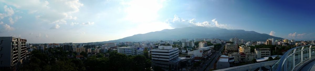 Panoramic view of city buildings against sky
