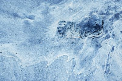 High angle view of footprints on snow