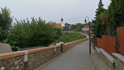 Street amidst buildings against sky