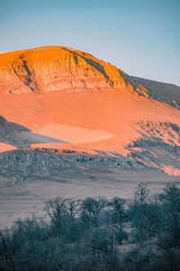 Scenic view of landscape against sky during sunset