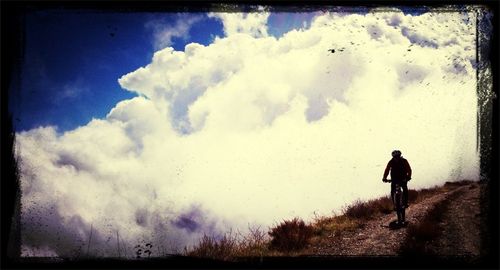 Silhouette of woman against sky