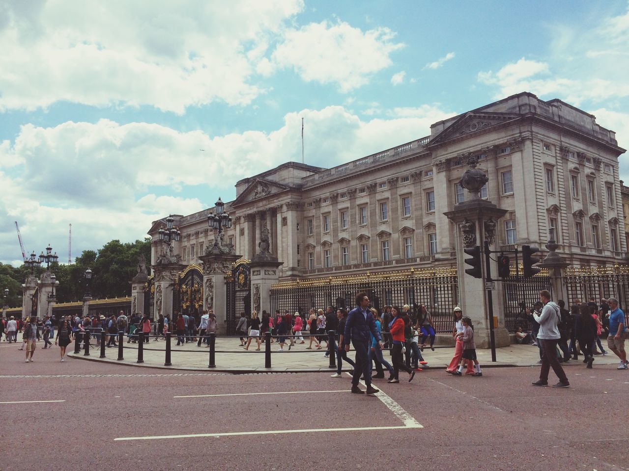 architecture, large group of people, building exterior, built structure, sky, person, men, famous place, history, travel destinations, cloud - sky, tourism, lifestyles, tourist, city, travel, international landmark, leisure activity, mixed age range