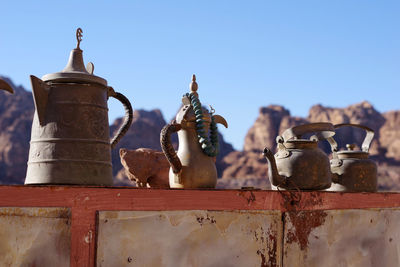 Close-up of rusty metal against clear blue sky