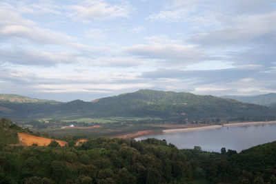 Scenic view of lake and mountains against sky