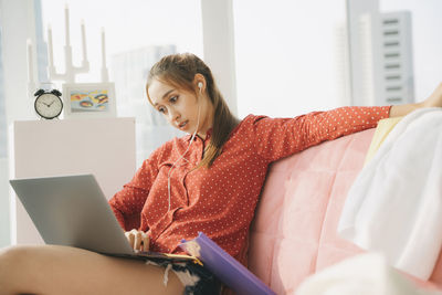 Young woman using mobile phone