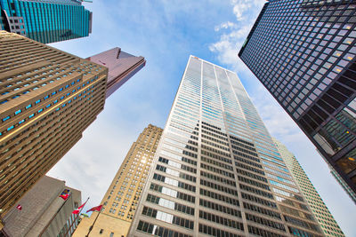 Low angle view of modern buildings against sky in city