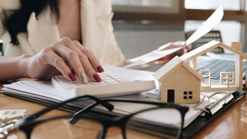 Midsection of woman working on table