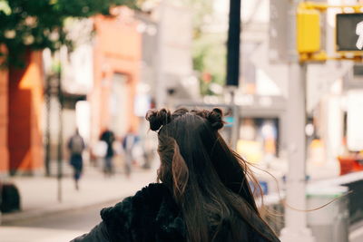 Portrait of woman on street in city