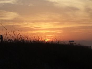 Scenic view of silhouette landscape against sky during sunset