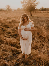 Young woman standing on field