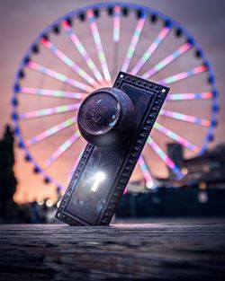 Close-up of illuminated ferris wheel