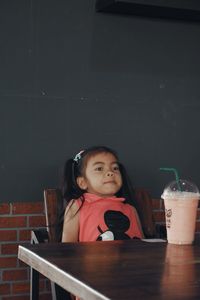 Girl sitting on table