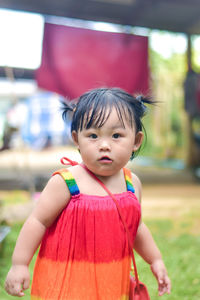 Portrait of cute girl standing outdoors