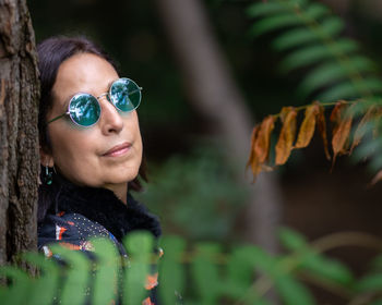 Portrait of young woman wearing sunglasses