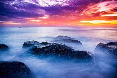 Scenic view of sea against sky during sunset