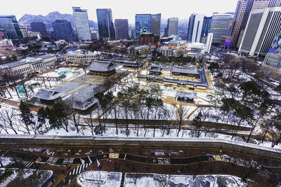 High angle view of buildings in city during winter