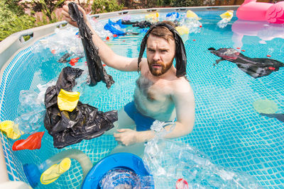Young man in swimming pool