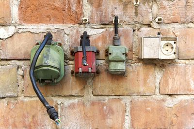 Close-up of old telephone on wall