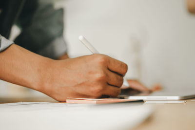 Close-up of man working on table