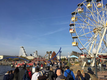 People enjoying amusement park ride