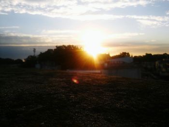 Scenic view of landscape against sky during sunset