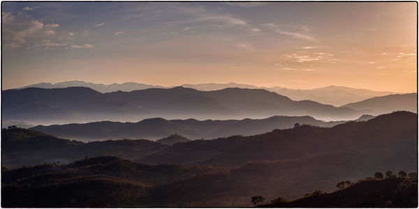 Scenic view of mountains against sky during sunset