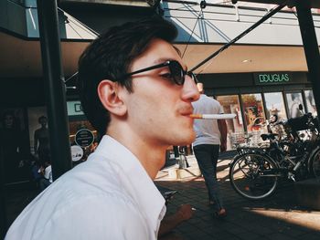 Portrait of young man looking away