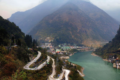 High angle view of road amidst mountains in city